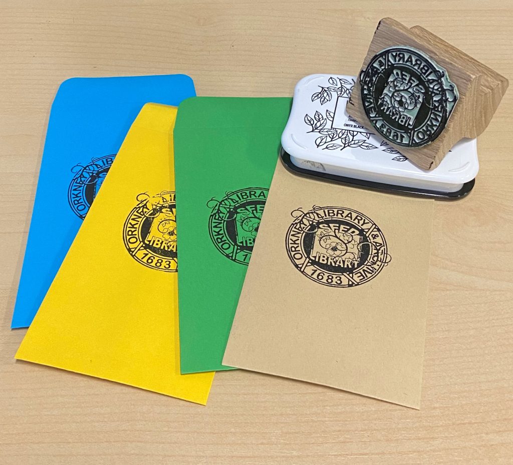 Seed packets and ink stamp